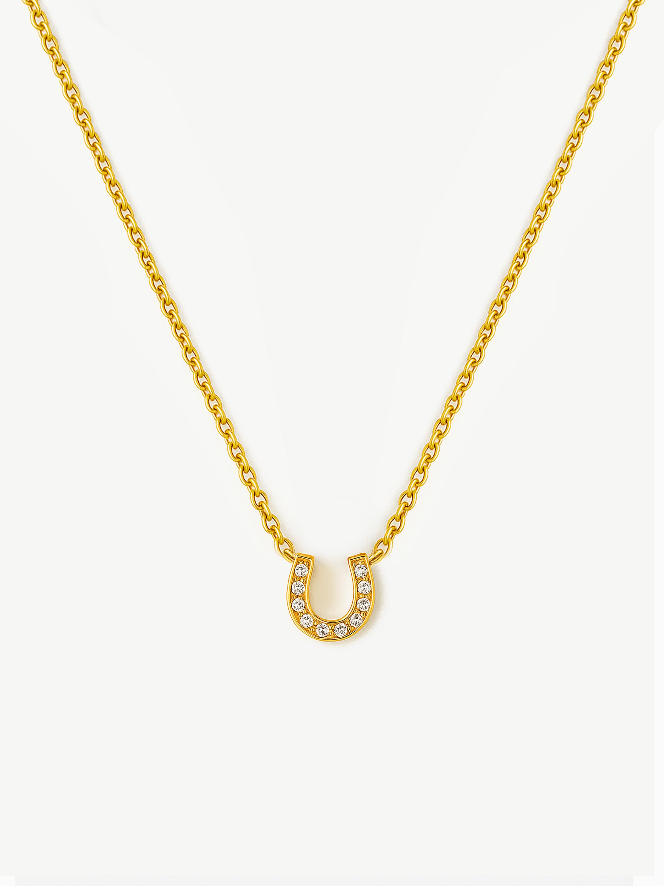 Collier délicat avec pendentif en forme de fer à cheval